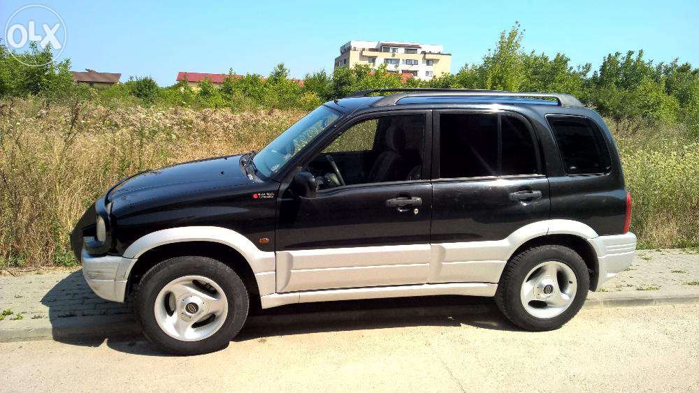 73550142_1_1000x700_suzuki-grand-vitara-stare-exceptionala-25-v6-taxa-platita-bucuresti.thumb.jpg.6d6279991c63806493c7b74b6717ea5d.jpg